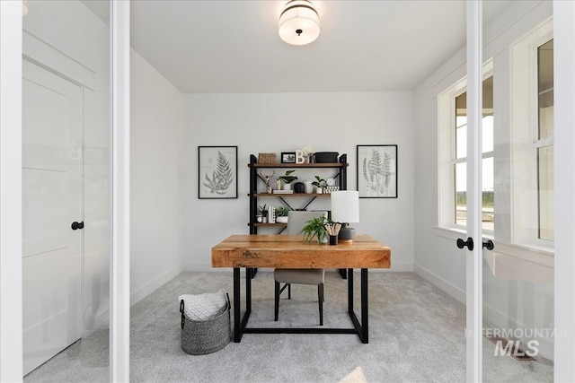 home office featuring light colored carpet and french doors