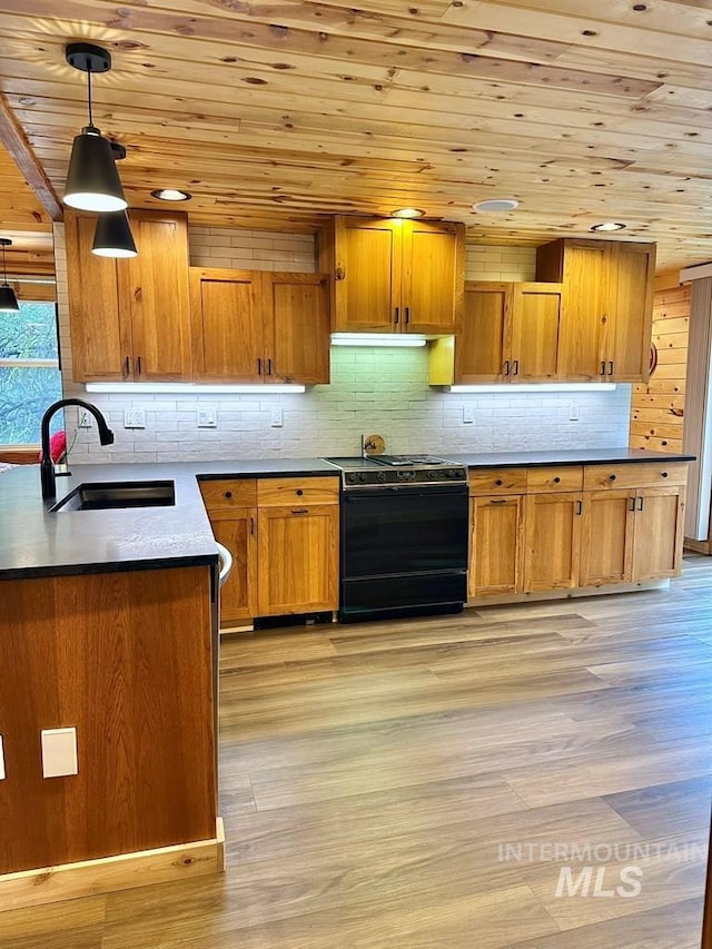 kitchen with black electric range oven, light wood-style flooring, wooden ceiling, a sink, and brown cabinets