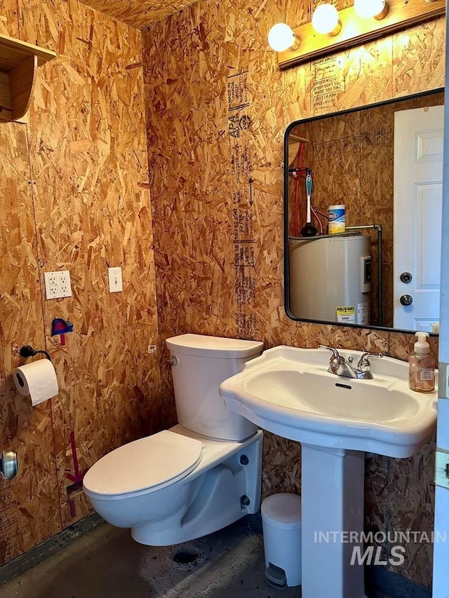 bathroom with electric water heater and toilet