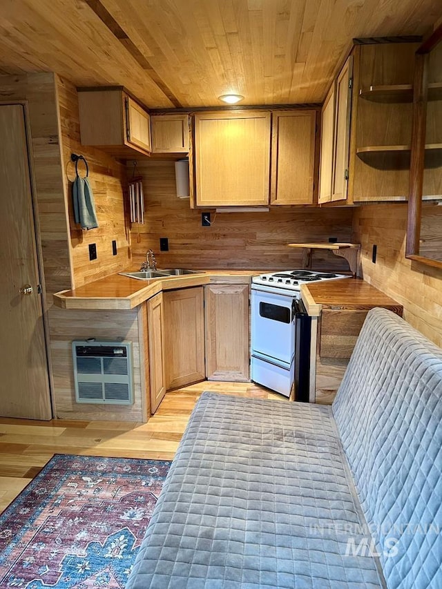 kitchen featuring heating unit, wood ceiling, white range oven, light wood-type flooring, and wooden walls