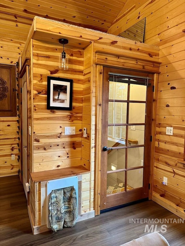 doorway to outside with dark wood-style flooring, wood walls, and wood ceiling