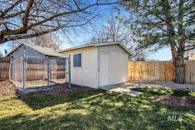 view of shed with a fenced backyard