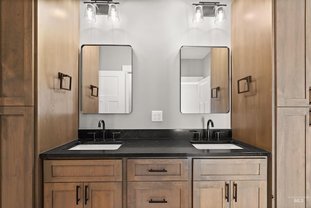 bathroom with double vanity and a sink