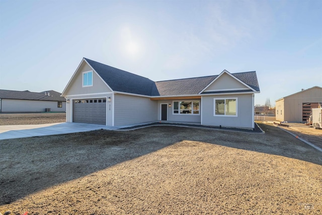 ranch-style home with driveway and an attached garage