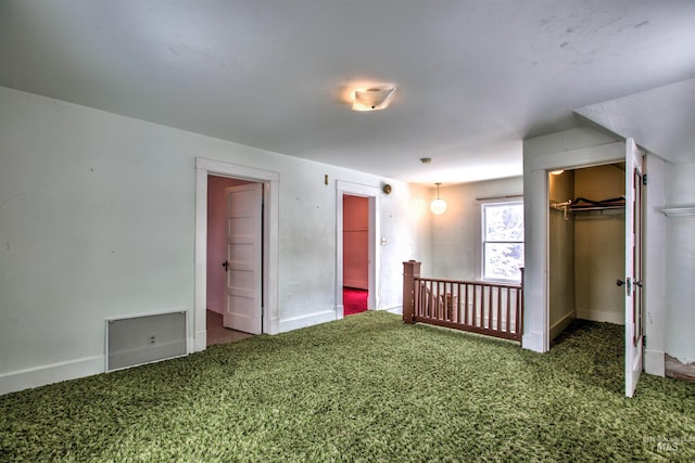 unfurnished bedroom featuring carpet floors and a closet