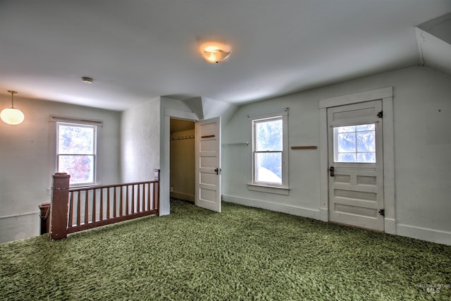 bonus room featuring carpet floors, a wealth of natural light, and lofted ceiling