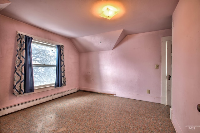 bonus room featuring lofted ceiling and a baseboard heating unit