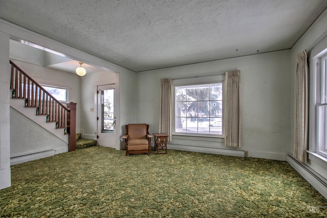 unfurnished room featuring a textured ceiling, carpet floors, and baseboard heating