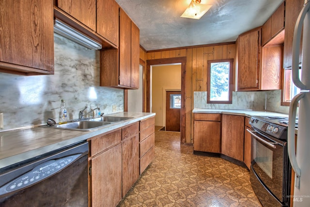 kitchen with tasteful backsplash, sink, and black appliances