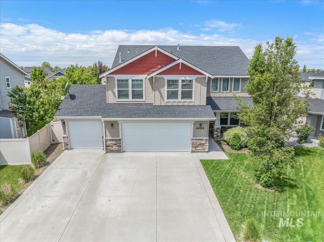 4665 N Beaham Ave, Meridian, ID 83646 - craftsman-style home with stone siding, concrete driveway, and roof with shingles