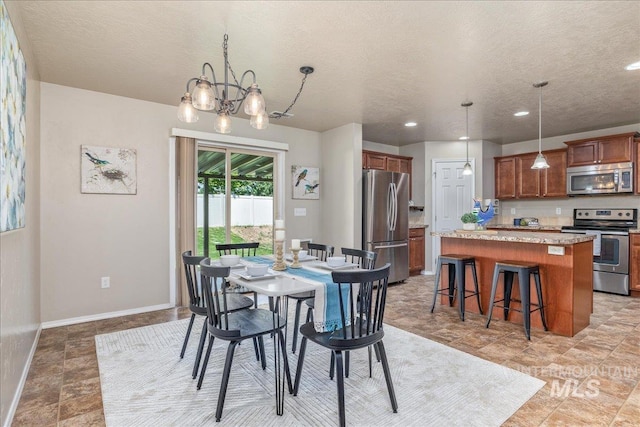 4665 N Beaham Ave, Meridian, ID 83646 - dining area with a textured ceiling, a chandelier, recessed lighting, and baseboards