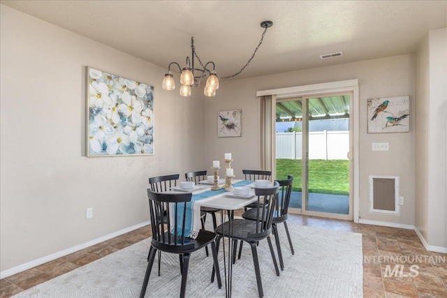 4665 N Beaham Ave, Meridian, ID 83646 - dining space featuring a chandelier and baseboards