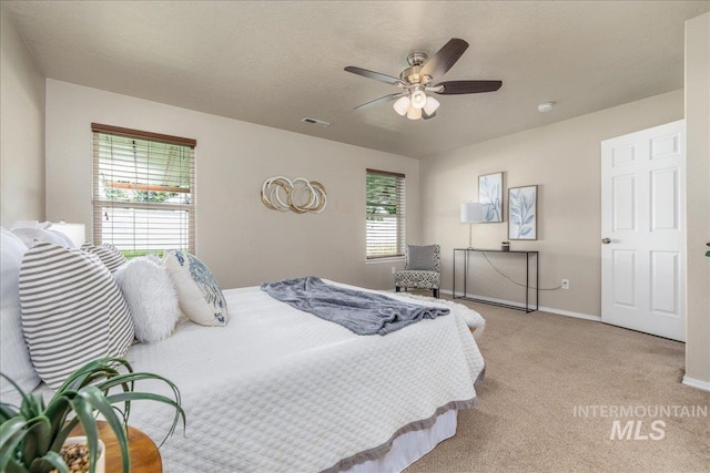 4665 N Beaham Ave, Meridian, ID 83646 - bedroom featuring light carpet, baseboards, and a ceiling fan