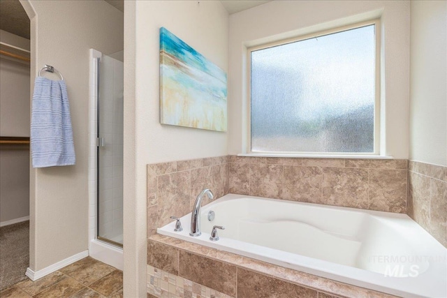 4665 N Beaham Ave, Meridian, ID 83646 - bathroom with healthy amount of natural light, a garden tub, and a stall shower