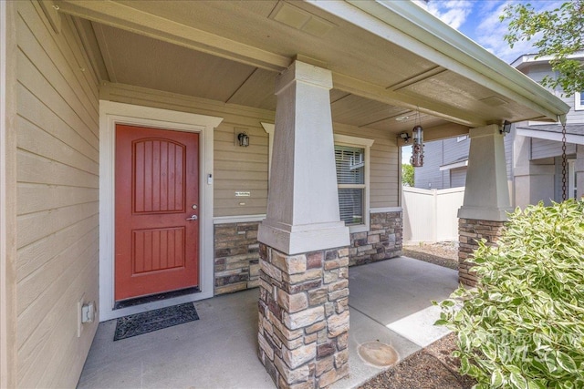 4665 N Beaham Ave, Meridian, ID 83646 - doorway to property with stone siding and covered porch