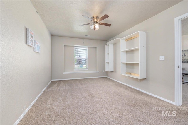 4665 N Beaham Ave, Meridian, ID 83646 - carpeted empty room featuring a ceiling fan, baseboards, and a textured ceiling