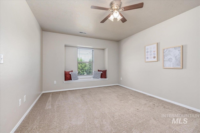 4665 N Beaham Ave, Meridian, ID 83646 - unfurnished room with carpet floors, a ceiling fan, baseboards, and a textured ceiling