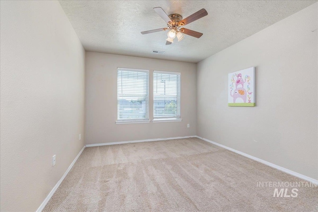 4665 N Beaham Ave, Meridian, ID 83646 - carpeted spare room featuring a textured ceiling, baseboards, and a ceiling fan