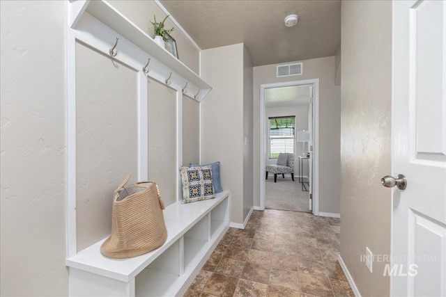 4665 N Beaham Ave, Meridian, ID 83646 - mudroom featuring stone finish flooring and baseboards