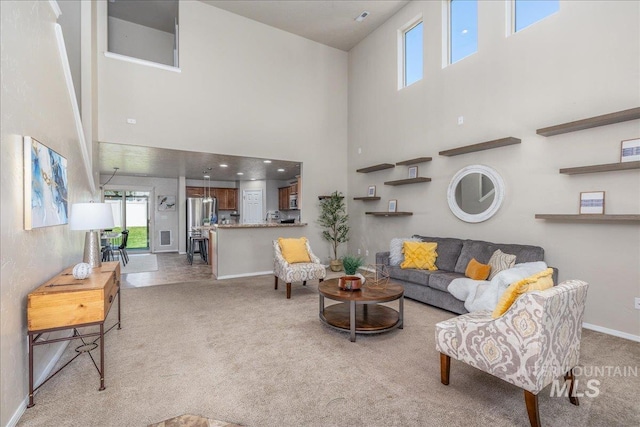 4665 N Beaham Ave, Meridian, ID 83646 - living area featuring a high ceiling, light carpet, and baseboards