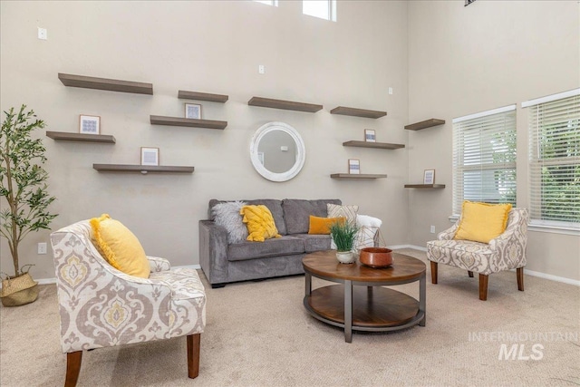 4665 N Beaham Ave, Meridian, ID 83646 - carpeted living room featuring baseboards and a towering ceiling