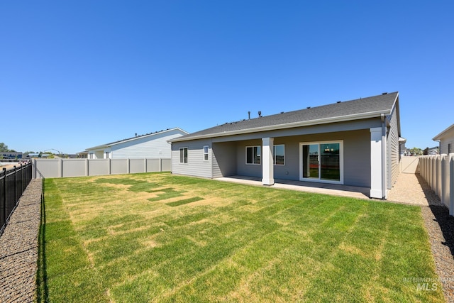 8601 W Pond Pine St, Star, ID 83669 - back of house featuring a fenced backyard and a patio area