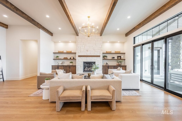 3426 N Hardwick Ave, Eagle, ID 83616 - living area with light wood-type flooring, beam ceiling, a chandelier, a stone fireplace, and recessed lighting