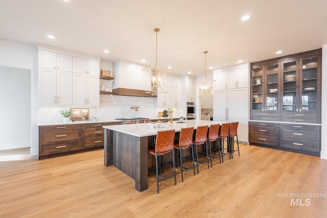 3426 N Hardwick Ave, Eagle, ID 83616 - kitchen with custom exhaust hood, light countertops, white cabinetry, open shelves, and recessed lighting
