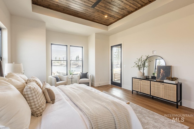 3426 N Hardwick Ave, Eagle, ID 83616 - bedroom featuring wooden ceiling, a tray ceiling, multiple windows, wood finished floors, and recessed lighting