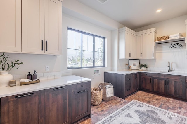 3426 N Hardwick Ave, Eagle, ID 83616 - kitchen with light countertops, open shelves, white cabinetry, dark brown cabinetry, and recessed lighting