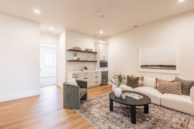 3426 N Hardwick Ave, Eagle, ID 83616 - living room featuring light wood-type flooring, ceiling fan, recessed lighting, and wine cooler