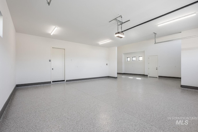 3426 N Hardwick Ave, Eagle, ID 83616 - garage with baseboards and a garage door opener