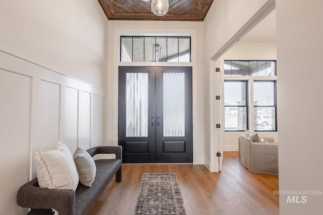 3426 N Hardwick Ave, Eagle, ID 83616 - foyer entrance featuring french doors, wood finished floors, wood ceiling, and a decorative wall