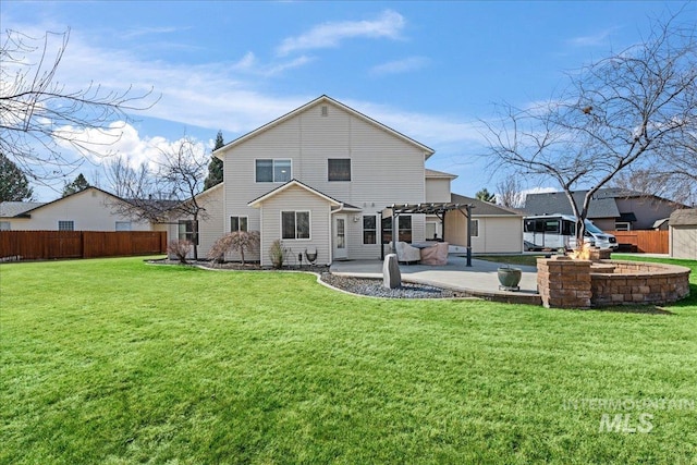 back of property featuring a patio area, fence, a pergola, and a lawn