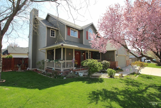view of front of home with a front lawn, covered porch, driveway, a chimney, and fence