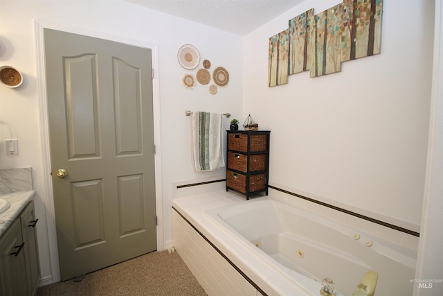 full bath with a jetted tub and vanity