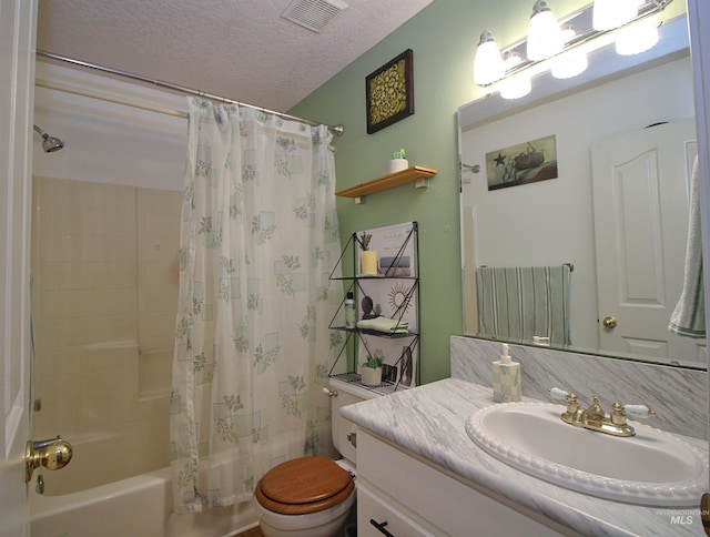 bathroom featuring shower / bath combo, toilet, vanity, visible vents, and a textured ceiling