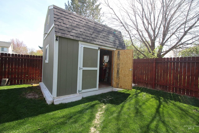 view of shed with a fenced backyard