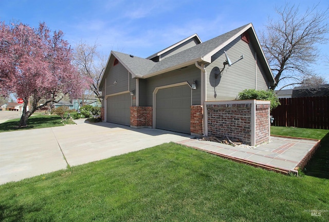 view of property exterior with brick siding, fence, a garage, roof with shingles, and a lawn