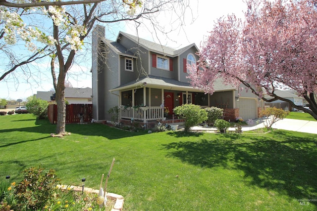 traditional-style home with a chimney, a porch, a front lawn, concrete driveway, and an attached garage