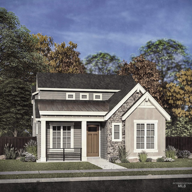6088 S Apex Ave, Meridian, ID 83642 - view of front facade with a standing seam roof, stone siding, metal roof, covered porch, and roof with shingles