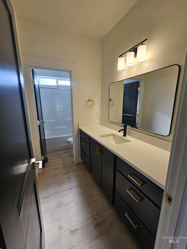 436 Autumn Blaze, New Plymouth, ID 83655 - bathroom featuring toilet, vanity, and wood finished floors