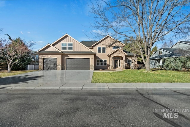 craftsman-style home featuring stone siding, a front lawn, board and batten siding, and driveway