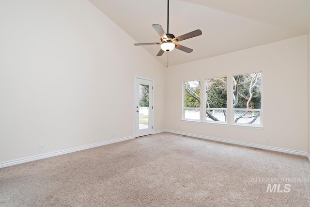 carpeted empty room featuring visible vents, high vaulted ceiling, a ceiling fan, and baseboards