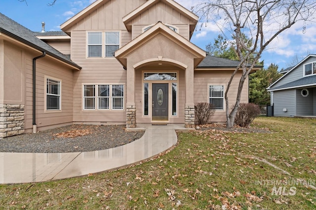 view of front of home with board and batten siding and a front yard