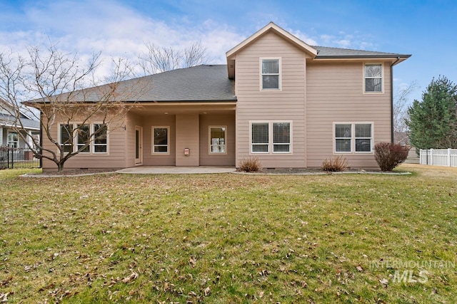 back of property featuring a yard, a patio area, and fence