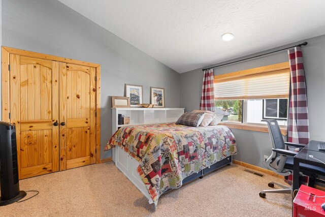 1017 Potts Dr, Mccall, ID 83638 - carpeted bedroom with vaulted ceiling and baseboards