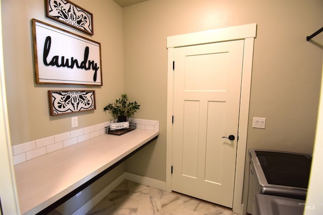 interior space featuring marble finish floor and baseboards