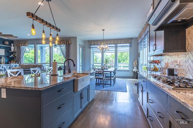 9473 W Suttle Lake Dr, Boise, ID 83714 - kitchen featuring a sink, stainless steel appliances, healthy amount of natural light, and ventilation hood
