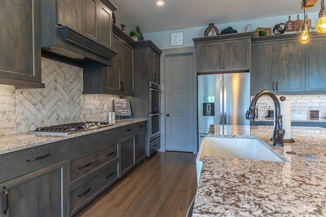 9473 W Suttle Lake Dr, Boise, ID 83714 - kitchen with a sink, tasteful backsplash, light stone countertops, and recessed lighting